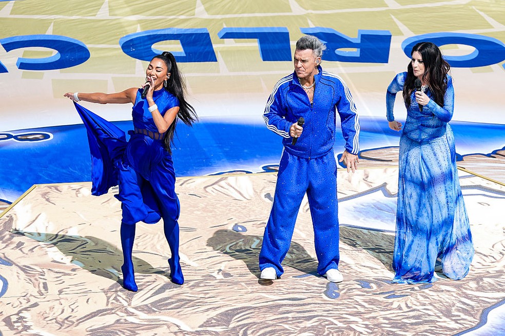 Nicole Scherzinger, Robbie Williams e Laura Pausini — Foto: GettyImages
