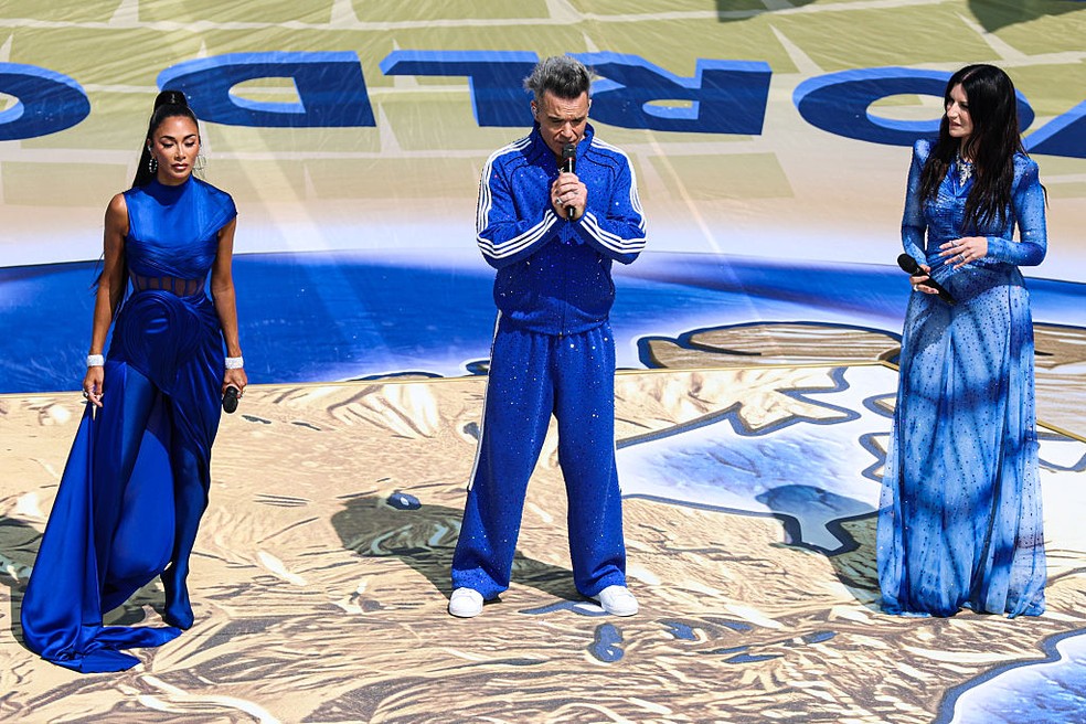 Nicole Scherzinger, Robbie Williams e Laura Pausini — Foto: GettyImages